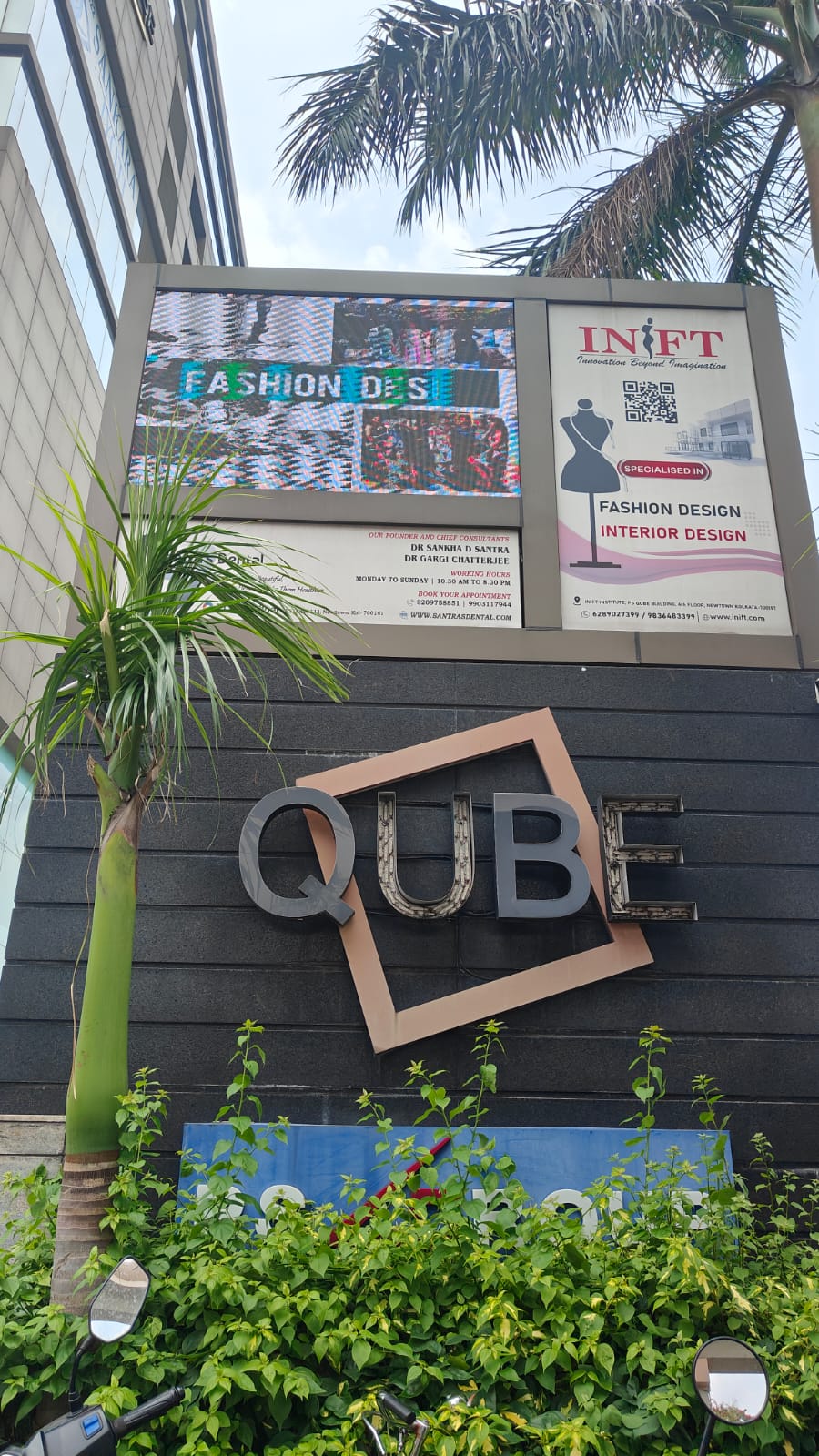 Exterior entrance signage at the Qube office building